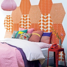 This honeycomb of wallpaper offcuts makes for a bold and eye-catching headboard | via http://www.101woonideeen.nl