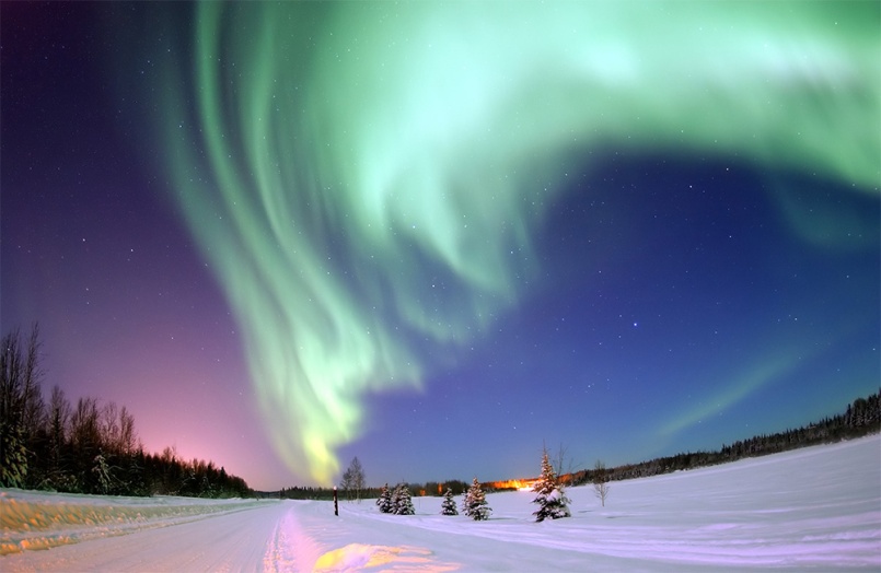 The Aurora Borealis, or Northern Lights, shines above Bear Lake | Image: Senior Airman Joshua Strang via Wikipedia
