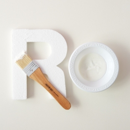 7) Paint the right side of the letter with a layer of modge podge.