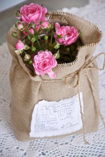 If your mum has green fingers consider rather giving her a potted plant - it will last so much longer. This little burlap bag adds a bit of character to these potted roses | via http://www.pinterest.com/pin/16466354857896365/
